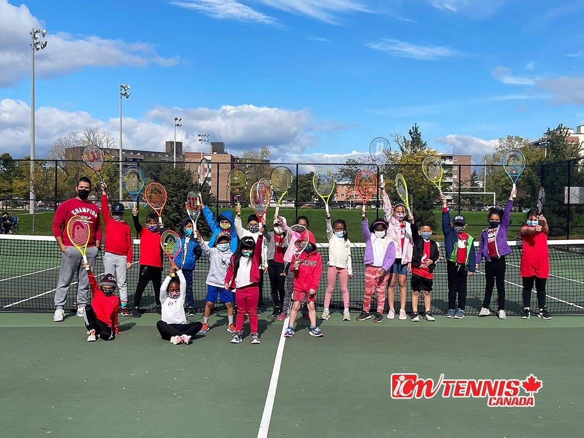 Young players raising their racquets on an outdoor court in Oshawa, with the ICM Tennis Canada logo.